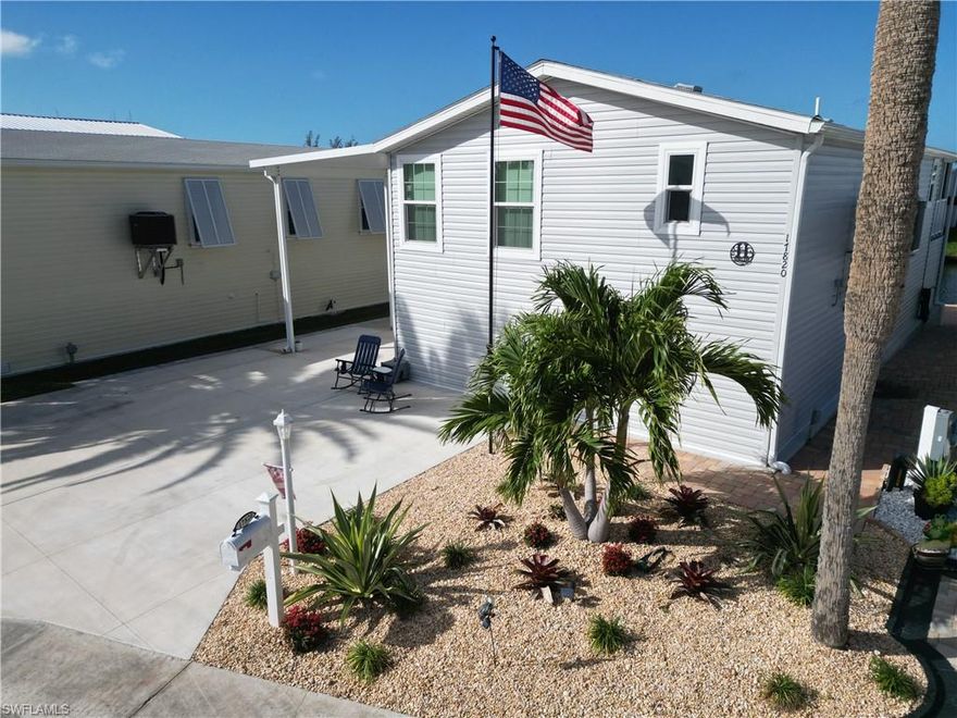 MOTIVATED Sellers will entertain all reasonable offers! Amazing Affordable Waterfront Paradise in Bayside Estates – Fort Myers Beach’s Best-Kept Secret! Discover ideal coastal living in this brand-new, elevated 2-bedroom/2-bath Lee Corp manufactured home, completed in spring 2025 and beautifully furnished as a turnkey coastal cottage. Just 2.5 miles by car (or a quick 10-minute boat ride) to Fort Myers Beach, this light-filled gem sleeps 6 and features an open-concept layout with vaulted ceilings, crown molding, remote control ceiling fans, and stylish coastal décor throughout. The modern kitchen boasts LG appliances, sleek quartz countertops, and flows seamlessly into the living areas. Enjoy stunning west-facing views and glorious Florida sunsets from the screened porch overlooking the canal. Built for peace of mind, it
includes a shingle roof, hurricane-impact windows and doors. Outdoor enthusiasts will love the covered 7000# boat lift, dock, pavers, carport, parking for up to 4 cars, 12x12 storage building, and ample under-home storage—perfect for water sports and boating gear. Nestled in the highly sought-after 55+ community of Bayside Estates, enjoy low HOA fees, a sparkling community pool, tennis courts, pickleball, and vibrant neighborhood events—all in a friendly, active adult setting. Don’t miss this rare opportunity for affordable, elevated waterfront living with easy beach access!