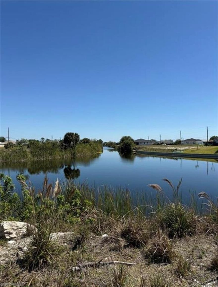 This OVERSIZED vacant lot offers a beautiful canal waterfront view and the perfect opportunity to build your dream home. Enjoy the peaceful water setting while still being conveniently close to restaurants, shopping, and everyday amenities. A great location that blends tranquility with accessibility—ideal for a custom residence or future investment.