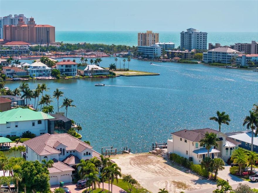 SELLER SAYS BRING ALL OFFERS !! Experience the very best of coastal Naples living from this southern-facing lot overlooking the tranquil waters of Vanderbilt Lagoon. This rare property offers the perfect blend of sun-soaked exposure, wide water views, and a lifestyle defined by leisure and luxury. Wake up to gentle Gulf breezes and watch the sun dance across the water from your private dock. With direct access to the Gulf of Mexico, boating and sunset cruises are just moments away. Whether you envision a contemporary coastal masterpiece or a timeless Florida retreat, this property provides the ideal canvas to bring your dream home to life. Located just minutes from Vanderbilt Beach, The Ritz-Carlton, and the fine dining and shops of Mercato, this address places you in the heart of Naples’ most desirable amenities while still offering a peaceful waterfront escape. Current home being shown is the Bayview Floor Plan with over 3,000 sq feet, 4 bedrooms, 3 and a half baths for $2,950,000 build price for a new home on the water for an "all in" price of under $6M.