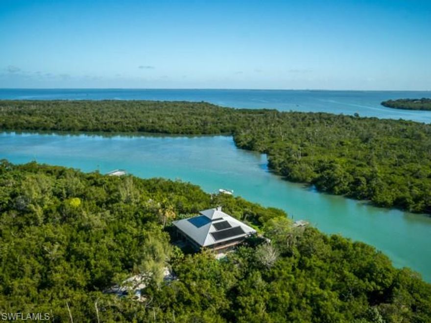 One-of-a-kind family compound on Captiva Island, FL. Approximately nine acres of undisturbed natural beauty-offering exceptional wildlife & birding. Property fronts 500 feet on Roosevelt Channel with deeded beach access to Gulf - being offered as one of two unique opportunities. Property contains two historic guest cottages; tastefully updated & maintained. Included is a one of a kind boat house with observation deck. Beautiful walking pathways and golf cart bridge over fresh water pond.