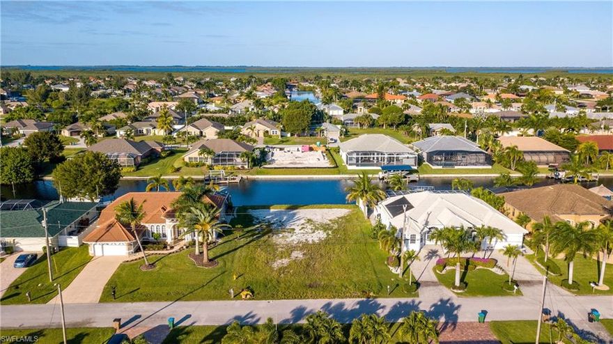 Great vacant lot with western rear exposure on 100 ft wide Camarin Canal in a beautiful neighborhood with new seawall already installed.