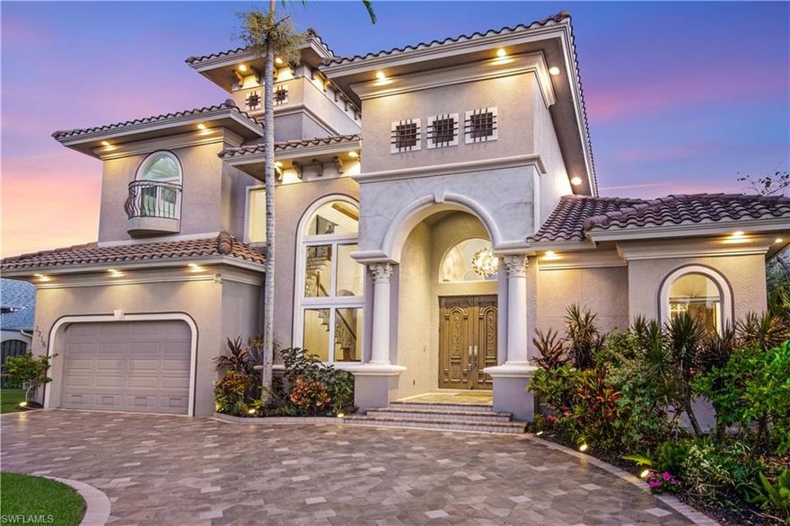 SOUTHERN EXPOSURE GULF ACCESS POOL HOME WITH 3,500+ SF, 4 BEDROOM W/DEN & 3.5 BATHROOMS. 
Decadence & style abound this stunning home where the palatial entry HAND CARVED MAHOGANY DOORS invite you in to this ONE-OF-A-KIND home where you are met with 24 ft ceilings and jaw dropping water views. Custom upgrades throughout, crown molding, natural light, impact glass, pavered circular driveway, tile roof, formal dining, family dining, separate family & living room w/linear fireplace, 15KW generator & central vac. The Chef’s kitchen is a recipe made with envy w/Thermador appliances, rich colored wood cabinetry, tile backsplash, breakfast bar & a center island. There's ceiling detail throughout including in the Study w/built-ins & a custom chestnut staircase. Travertine, wood, plush carpeting & tile floors throughout.  The spacious 686 sq ft 3/4 car garage w/15 ft ceiling, built-in compressor & car lift are what men's dreams are made of & for the ladies, a huge 1st floor Master w/sitting area, 2 walk-in closets & luxurious bath. Home provides the perfect setting to enjoy the 2 story lanai w/infinity pool, spa & summer kitchen. Boaters Dock w/20K Golden lift, canopy & shore power. 3dtour