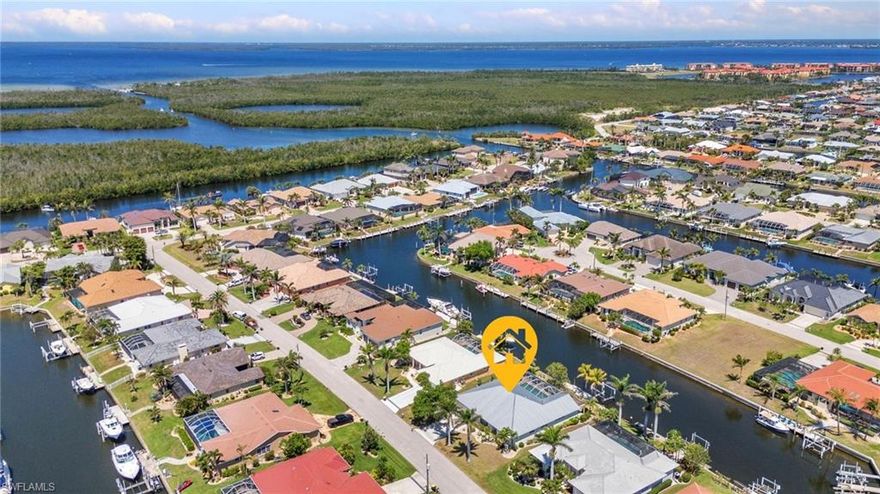 DIRECT SAILBOAT ACCESS WITH APPROX. 3-MINUTE ACCESS TO CHARLOTTE HARBOR. UPDATED WATERFRONT HOME WITH PRIVATE POOL, DOCK WITH LIFT, AND MAJOR SYSTEM IMPROVEMENTS ALREADY COMPLETED.

Thoughtfully renovated and ideally located in the heart of Punta Gorda Isles, this home offers a bright, coastal feel with an easy flow from the main living space to the lanai and water beyond. There is something special about mornings here—coffee in hand, doors open to the lanai, and peaceful canal views beginning your day.

Inside, the updated kitchen features quartz countertops, custom cabinetry, and newer stainless steel appliances, opening to a light filled living space with luxury vinyl plank flooring throughout. Both bathrooms have been updated with a clean, cohesive design, and fresh interior paint enhances the bright, coastal feel.

This 3 bedroom, 2 bathroom home with a 2 car garage plus den/office/bonus room offers a comfortable and functional layout suited for both everyday living and entertaining.

Major improvements include metal roof in 2024, PEX plumbing in 2024, electrical update in 2022, boat lift in 2021, and HVAC in 2019, per seller. Storm shutters are in place. The home did not experience interior water intrusion during recent storms, per seller.

The screened lanai and sparkling pool overlook the canal, creating a natural extension of the home, while a spiral staircase leads to an elevated observation deck with wide water views and soft evening skies and sunset reflections over the canal.

The city maintained seawall, a rare and valuable benefit in Punta Gorda Isles, provides added peace of mind and long term value for waterfront ownership.

Located just minutes from Fishermen’s Village, marinas, waterfront dining, and historic downtown Punta Gorda, this home is also near Ponce de Leon Park with walking trails, harbor views, and a small sugary sandy shoreline. Punta Gorda’s vibrant and nationally recognized dining scene, including a local chef who has gained national recognition and competed at the highest levels, adds to the appeal and highlights why Punta Gorda Isles continues to be one of Southwest Florida’s most beloved waterfront communities.

Your sailboat waterfront lifestyle in Punta Gorda Isles is waiting to be your slice of Southwest Florida paradise