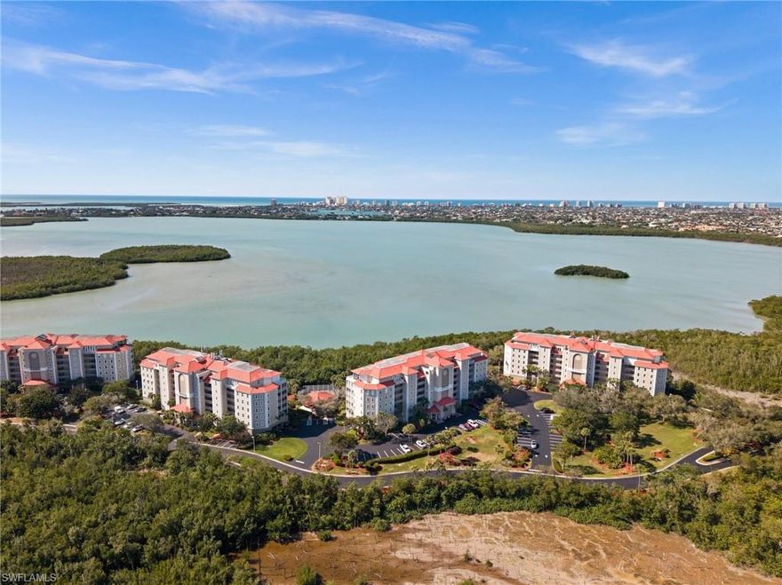 Welcome to 201 Vintage Bay Drive where serene waterfront living meets effortless comfort in one of Marco Island’s most peaceful gated communities. Perched on the 4th floor, this beautifully updated 3-bedroom, 2-bath residence offers sweeping, unobstructed views of Barfield Bay over the lush native mangroves. From the moment you enter, the high ceilings and expansive layout create a light, airy feel more like a private home in the sky than a typical condo. The heart of the home is a thoughtfully remodeled kitchen (2022), complemented by modern upgrades throughout, including a new AC (2022), washer (2024), and brand-new impact windows and sliders (2024). Electric hurricane shutters on all windows and the spacious screened balcony provide both convenience and peace of mind. The oversized screened balcony is the true showpiece, your front-row seat to Marco Island’s natural beauty. Start your mornings with coffee as dolphins and manatees play and birds glide over the bay. Wind down each evening with stunning sunsets that paint the sky. Quiet, private, and surrounded by nature, this is a space you’ll never want to leave. The primary suite and guest bedrooms are generously sized, offering comfort and flexibility for family and visitors. Additional features include two private storage lockers in the under-building garage, wide open hallways, and a secure building with keypad access.
Residents enjoy a friendly, welcoming atmosphere in a well-maintained gated community that allows pets (one up to 25 lbs or two totaling 30 lbs) and flexible rental opportunities (minimum 30 days, up to 12 times per year).
If you’ve been searching for peaceful waterfront views, modern updates, and a true sense of retreat—this is it.