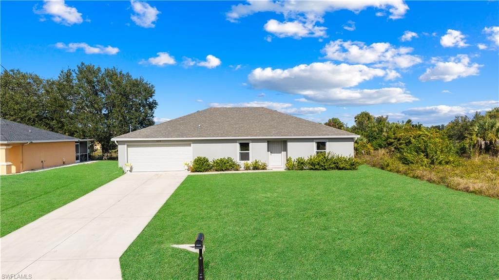 Photo of 4216 20th ST SW, LEHIGH ACRES, FL 33976 (MLS # 225084391)