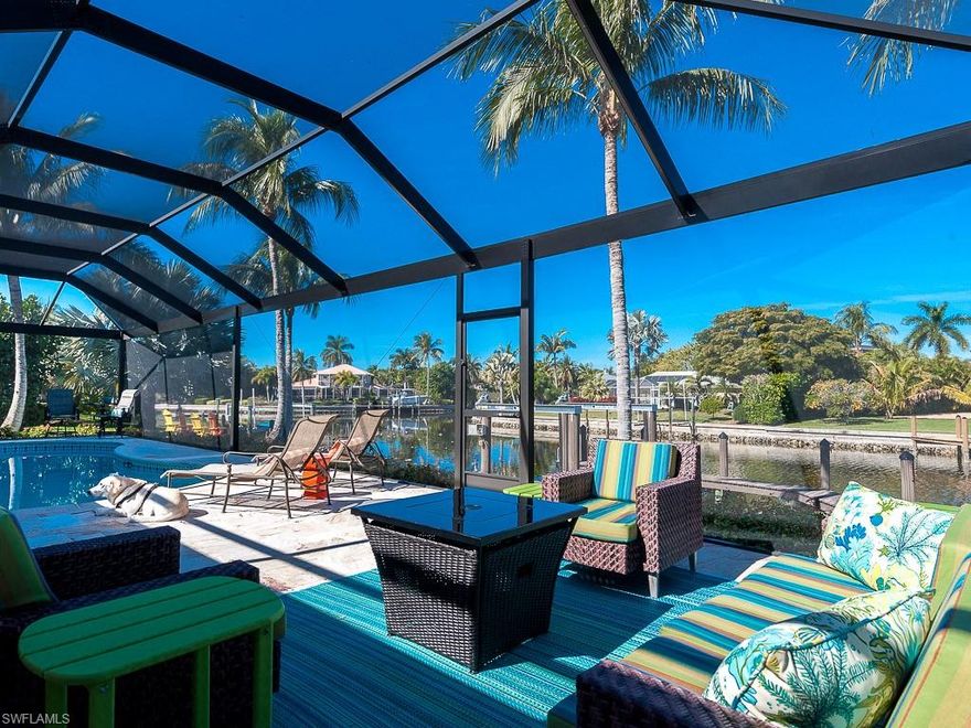 The BEST of Sanibel, 3bed/3bath canal home with 16k lb. boat lift, screened pool and spa, AND one block from the beach! Lounge out on the screened lanai and watch the manatees surface in the canal. Lower the boat and head out to the Gulf with only one bridge to bay. Catch and cook dinner on the grill and enjoy your highly desirable waterfront view on the corner of three waterways. A spacious kitchen with two pass-thru counters makes serving meals easy. Slide open the pocketing glass doors for a true indoor/outdoor experience. Upstairs, the master suite includes a spacious home office with windows overlooking the canal - perfect for working from home! The bathroom features dual sinks and a beautiful glass shower. Two guest rooms on the main living level offer plenty of space for guests, and the two-car garage offers plenty of storage for beach gear. Located on a quiet street with easy access to the causeway. Beautiful landscaping completes your paradise dream home!