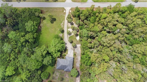 Photo of 5681 Bur Oaks LN, NAPLES, FL 34119 (MLS # 226032866)