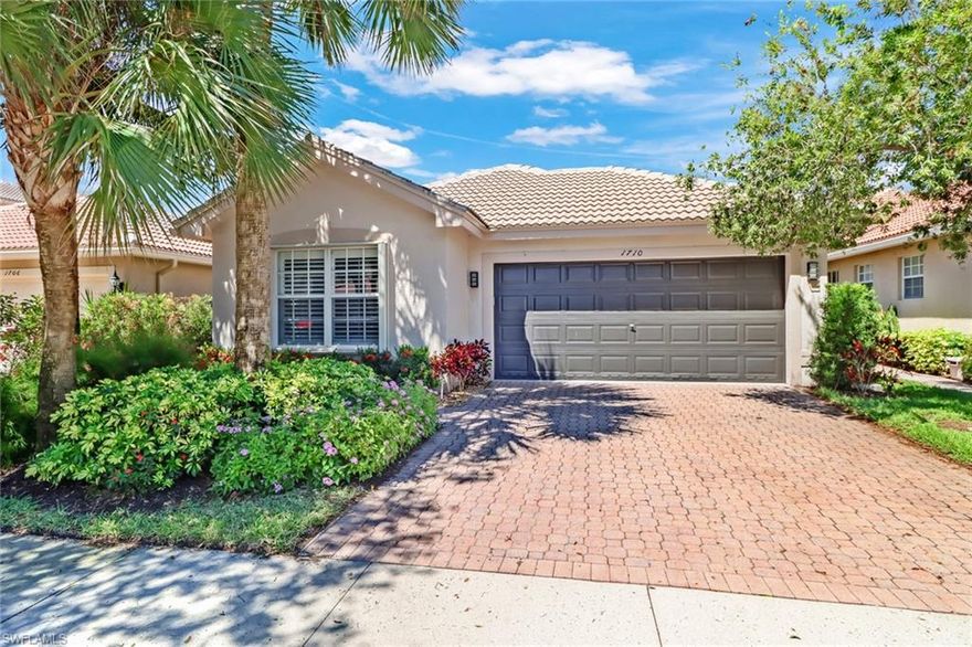 Beautifully maintained and upgraded Cortina model, boasting custom flooring, cabinetry and brand new interior paint and landscape. This ideally situated lot enjoys a quiet and serene lake view with extended patio for indoor/outdoor living. The popular split floor-plan has a spacious master with tray ceiling and spacious closet with luxurious master bath and soaking tub. The functional kitchen space offers ample cabinet and countertop space for cooking and hosting with pass-through bar top. Saturnia Lakes is a secure and gated community featuring a newly renovated clubhouse with resort pool, well-appointed gym, sports park and miles of walking and nature trails. This home is centrally located close to popular Logan landings, new Founders Square, and quick access to 75, Logan extension and popular shops and restaurants in A rated Gulf Coast school district.