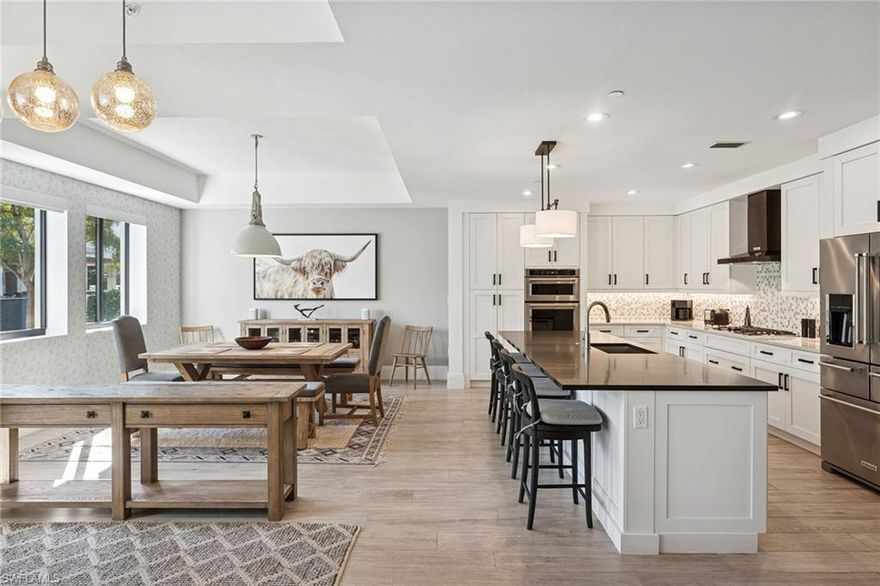 A rare residence available for rent annually in Naples Square.  Enjoy the privacy and convenience of a single-family home in this spacious 2-story, 3-bedroom + den home with a private garage and all the perks of downtown condo living. Private entrance, with community pool deck and amenities at condo level make this a uniquely private unit.  First floor features a spacious open living/dining area with updated kitchen boasting ample cabinetry, high-end appliances (including gas cooktop!) and oversized island with seating. One first floor bedroom with private full bath, as well as a powder room on the first floor. Take your private elevator or stairs up to the second floor to the owner’s retreat complete with an oversized king bedroom, spa-style bath, balcony, and second living room. A third bedroom with its own full bath, a second powder room,  and a full-size laundry room complete the package. Built in 2019, this unit features impact-resistant doors and windows. With the highest walkability score in Naples, you are in recreational and biking distance to everything, including dozens of restaurants, shops on 5th Avenue, 3rd Street, Bayfront, The Design District, groceries, marinas, the beach and more. The building is rich with amenities, including a pool, hot tub, barbecue area, fire pits, social room, fitness center and bike storage as well as a vibrant social community. Some furnishings and artwork may differ from photos shown, partially furnished negotiable.