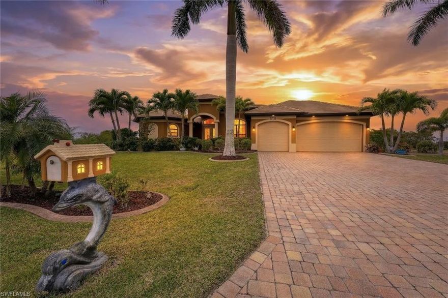 Welcome to an extraordinary waterfront estate where luxury, design, and Florida living converge. Situated on an oversized triple lot with lush, mature palms and fruit trees, this gulf access pool home offers an unparalleled lifestyle in one of Cape Coral’s most desirable locations. From the moment you arrive, the expansive driveway and 3 car garage set the tone for the scale and sophistication found throughout. Inside, soaring ceilings create a grand yet inviting ambiance, featuring coffered detailing in the living room and a tray ceiling in the primary suite, complemented by elegant travertine flooring and tile throughout the bedrooms. Plantation shutters add a timeless, refined touch across the home. Designed for seamless indoor-outdoor living, 90 degree sliding glass doors fully open to an impressive under truss lanai, transforming the home into a true entertainer’s retreat. The outdoor space is nothing short of spectacular complete with a fully equipped summer kitchen, custom pergola, and even a private sauna for the ultimate resort-style experience. The expansive pool features a tranquil waterfall feature, while the guest bath conveniently doubles as a pool bath. Whether hosting or relaxing, every detail has been thoughtfully curated for comfort and style. Inside, the open-concept floor plan with split bedrooms offers both functionality and privacy. The kitchen is a chef’s dream, showcasing a large island with breakfast bar seating, Samsung appliances, a sleek Robam hood, and a dedicated wine/bar area perfect for entertaining. A spacious in-residence laundry room includes LG washer and dryer. The primary suite is a private sanctuary with direct lanai access, a custom-designed walk-in closet, and a spa-inspired bath featuring dual vanities, a walk-through shower with multiple shower heads, and a striking soaking tub as its centerpiece. Outdoors, the waterfront lifestyle continues with a Tangent decking, 7,500 lb boat lift with canopy, and a charming tiki hut complete with fishing rod holders—ideal for sunset evenings or early morning fishing. Additional upgrades include portable ac unit in garage, impact windows and doors, Kevlar shutters for peace of mind and a separate she-shed! This is more than a home, it’s a statement of lifestyle, where every detail reflects quality, comfort, and coastal luxury.