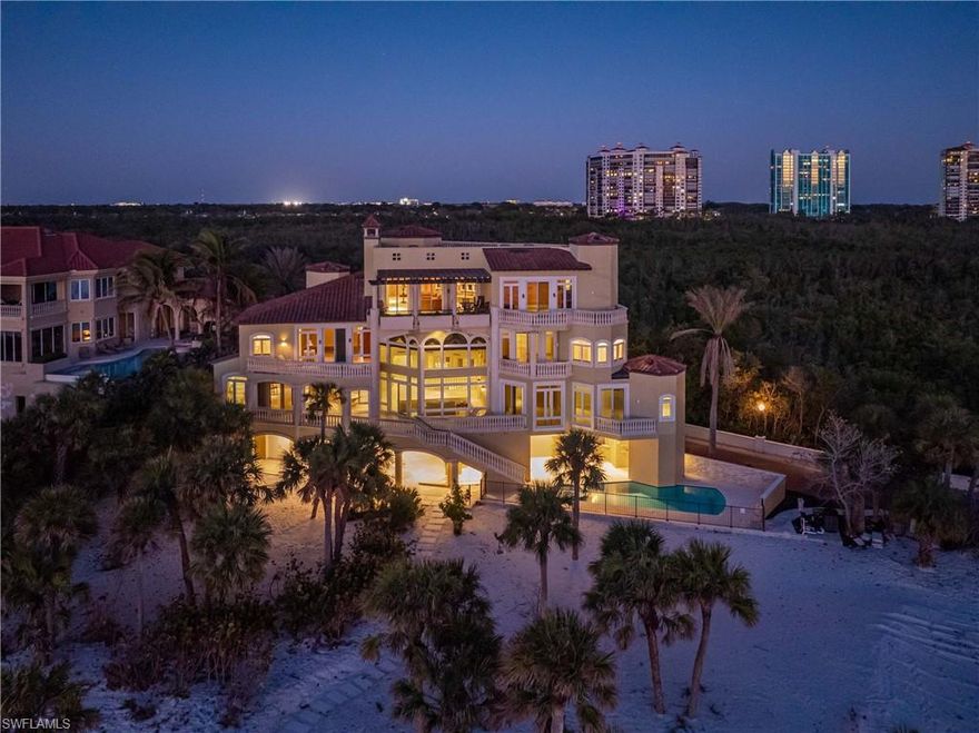 This unparalleled coastal luxury at 7425 Bay Colony Drive, an exclusive beachfront residence within the double-gated Strand at the Colony of Pelican Bay. As one of only eleven homes in this prestigious enclave, it offers over 9,000 square feet of refined living space, including a den, five bedrooms, and seven and a half bathrooms. Designed to maximize natural light and panoramic Gulf of Mexico views, the home's southward orientation ensures sunlit elegance throughout along with 130 feet of beachfront. Adjacent to a serene preserve, it provides uninterrupted natural vistas, fostering a profound connection with the surrounding landscape. Residents enjoy access to a private beach club and the world-class Ritz Carlton, enhancing an already luxurious lifestyle. This property epitomizes the pinnacle of coastal living, combining prime location, exclusivity, and top-tier amenities into a singular seaside sanctuary.