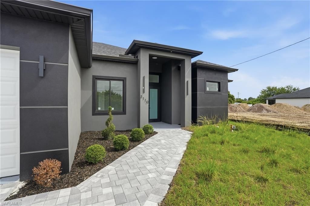 Photo of 3110 23rd ST SW, LEHIGH ACRES, FL 33976 (MLS # 226016006)