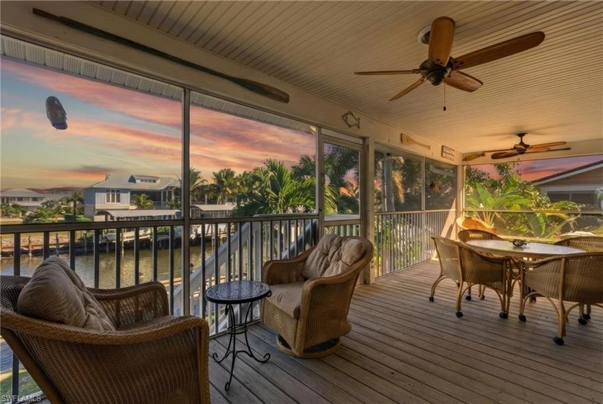 Live the ultimate Pine Island waterfront lifestyle in Captain’s Cove, perfectly positioned on a deep-water, wide canal with direct Gulf access and some of the best fishing in Southwest Florida. Located in Bokeelia on beautiful Charlotte Harbor, this boater’s and angler’s retreat is tucked away on a quiet cul-de-sac and offers effortless access to Pine Island Sound, Charlotte Harbor, and the Gulf of America.

Pine Island, the largest island on Florida’s Gulf Coast, is beloved for its Old Florida charm, quiet roads, and world-class access to fishing and boating—making it a rare find for a true coastal lifestyle.

For those who love life on the water, the property features a private 72-foot dock, a boat lift, and seven fishing stations, with convenient water and electric at the dock, making it easy to head out at a moment’s notice or cast a line right from your backyard. Pine Island is world-renowned for fishing, with grouper, redfish, snook, sea trout, cobia, and tarpon regularly caught in nearby waters.

From this prime location, enjoy easy boating access to Captiva Island, Sanibel Island, and Boca Grande—known as the “Tarpon Capital of the World” and home to legendary tarpon fishing tournaments that draw anglers from around the globe. Quick runs to Jug Creek, surrounding backwater canals, and open water make this an ideal home base for fishing excursions, island hopping, and unforgettable sunset cruises.

Outdoor living takes center stage with a large screened-in porch overlooking the canal, providing the perfect space for entertaining, relaxing, or enjoying peaceful water views and coastal breezes. The oversized, 2 bay garage offers abundant room for vehicles, kayaks, fishing gear, workshop, and all your coastal toys.

Inside, the home features an open-concept floor plan with soaring cathedral ceilings, creating a bright and airy atmosphere throughout the main living areas. Hardwood floors anchor the living space, while the spacious waterfront kitchen offers generous counter space, ample cabinetry, two sinks, and a layout designed for entertaining—all with scenic water views. Dining here blends indoor comfort with the beauty of the outdoors.

The spacious primary suite serves as a private retreat, complete with a walk-in closet and direct access to the screened porch—ideal for morning coffee or relaxing evenings after a day on the water. A dedicated laundry room with additional cabinetry and counter space adds everyday convenience.

Located in the desirable Captain’s Cove waterfront community, residents also enjoy access to a community boat ramp. After a day on the water, unwind at nearby island favorites like Tarpon Lodge Restaurant, known for excellent dining, live music, and classic Old Florida charm which complements the laid-back Pine Island lifestyle.

This is more than a home—it’s a front-row seat to world-class fishing, iconic boating destinations, and the relaxed coastal lifestyle Pine Island is known for.