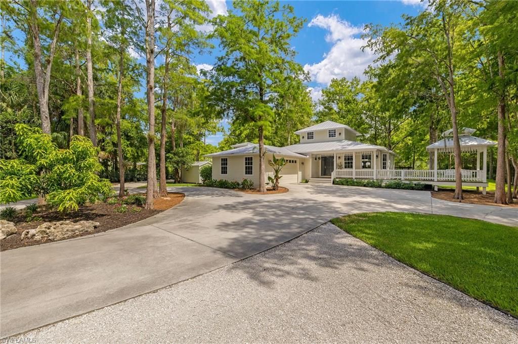 Photo of 5271 Cherry Wood DR, NAPLES, FL 34119 (MLS # 226005856)