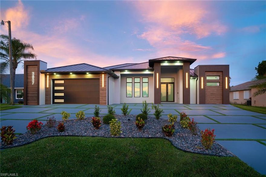 Embrace luxury living at its finest at this stunning Gulf access home in the prestigious Southwest Cape Coral. Designed with meticulous attention to detail, the home features three spacious bedrooms, each boasting its own en-suite bathroom and custom closets, as well as an expansive office with incredible natural light.
The expansive open-concept interior includes a custom kitchen with flat front modern cabinetry and a spacious pantry, a dedicated home office, and a sophisticated wine room. Entertain effortlessly with a full outdoor kitchen, perfect for alfresco dining, and a private terrace leading to the heated pool and spa, ideal for relaxation under the Florida sun.
Centrally located near schools, restaurants and shops, this will make an ideal residence for a family that loves easy access to what this city has to offer. With city water and sewer assessments all paid, and located outside of flood zone, this home will
This home is a must see! Schedule your private tour today!