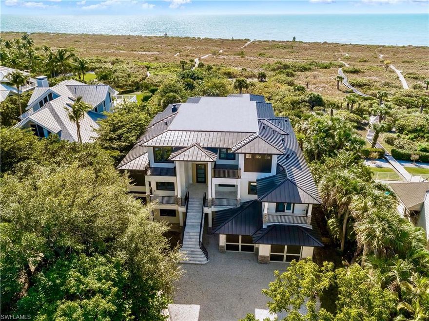 NEW CONSTRUCTION ON THE BEACH! Available for immediate occupancy. Gorgeous Coastal Contemporary Custom Built 5 Bedroom/ 5.1 Bath Luxury Estate Home located in one of Sanibel Islands premier beach front communities. Fantastic opportunity to enjoy all the new codes, materials, finishes, mechanicals that one wants in our market place without having to go thru the building process. Experience one of the best beach areas on the island known for privacy, sunsets, world class shelling, wide sandy dune beach areas, and more. This luxury residence features a gorgeous great room area with soaring wood beam ceilings, great wood work thru out, floating staircase, huge kitchen with large center island, 2 master suite areas, exercise room, bonus room areas, huge garage storage areas, 4 levels of awesome deck and lanai space, elevator, negative edge pool with spa, (paver driveway and beautiful landscaping coming soon), and so much more! The only new construction on the beach available.