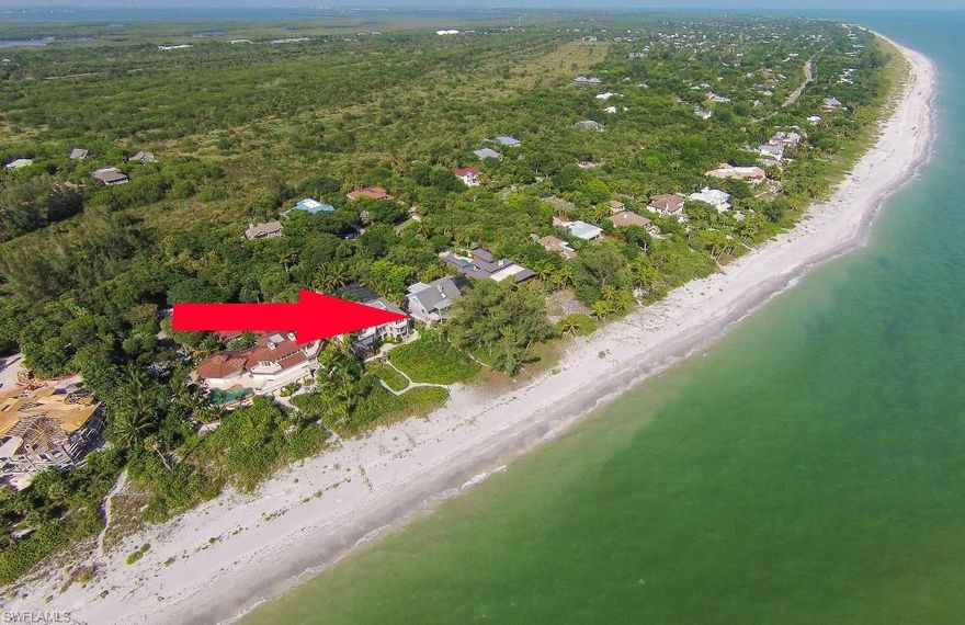 Stunning Gulf front views from this one of a kind, beach front home located on prestigious West Gulf Dr. Soaring ceilings, pocketing sliding glass doors in the front and back, and a multitude of windows allow for maximum air flow, natural lighting and views of the water from every angle. Only 40 steps from the deck to the beach as you wander through the canopy of trees to the Gulf waters. An enormous pool on the east side of the house allows for maximum sun exposure and lap swimming! The home has hard wood floors, an open floor plan with a bright and breezy feel and plenty of outdoor living space. This sale is "as-is" and with original owner of the property.