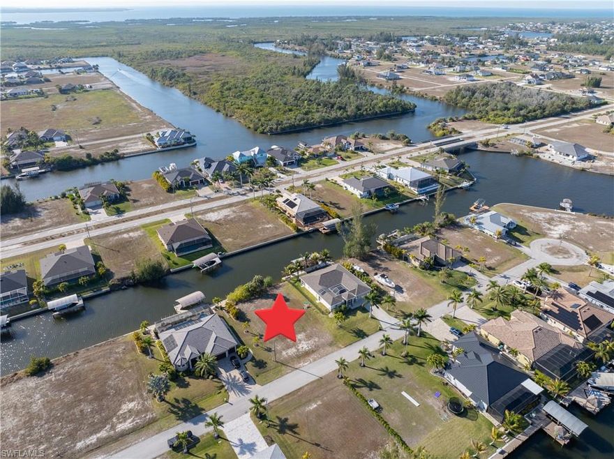 Gulf Access Living with Western Exposure and Room to Dream

There’s something deeply compelling about owning waterfront that offers both immediate lifestyle enjoyment and meaningful long-term potential. This Gulf access lot on the Sunfish Canal in Unit 61 offers approximately 80 feet of waterfront and a generous 125-foot depth, giving you the space and flexibility to design a home that reflects the way you truly want to live.

From your future backyard, boating becomes part of your everyday routine. Picture stepping out your back door, walking across your lanai, and boarding your boat for a spontaneous sunset cruise or a full day adventure. With access out to the Gulf of Mexico, you can explore the beaches and surrounding islands such as Cayo Costa, Cabbage Key, Sanibel, and Boca Grande. Whether it’s waterfront dining, shelling on a quiet shoreline, or heading offshore for world-class fishing, this location connects you effortlessly to the very best of Southwest Florida’s boating lifestyle.

The western exposure adds another layer of magic. Your future pool and outdoor living space will capture breathtaking sunsets over the canal, turning ordinary evenings into something unforgettable. The sky painted in shades of orange and pink, the water reflecting the last light of day — this is the kind of backdrop that makes home feel like a retreat.

Positioned about a mile from the highly anticipated Seven Islands development, this property sits in one of Cape Coral’s most talked-about and evolving areas. The City’s Vision Plan is bringing renewed attention and investment to this corridor, with beautiful custom homes already rising throughout the neighborhood. Being close to Seven Islands places you near future dining, marina activity, recreation, and gathering spaces that are expected to enhance both lifestyle and value over time.

Beyond the water, you’re only a few miles from an 18-hole championship golf course, with growing shopping and dining options nearby. Travel is convenient as well, with Southwest Florida International Airport approximately 30 miles away and Punta Gorda Airport roughly 20 miles from your doorstep.

This is more than just a vacant lot. It’s an opportunity to create a waterfront home that captures sunset views, exceptional boating access, and the momentum of a thriving area. If you’ve been waiting for the right place to build something extraordinary, this may be where your vision begins.