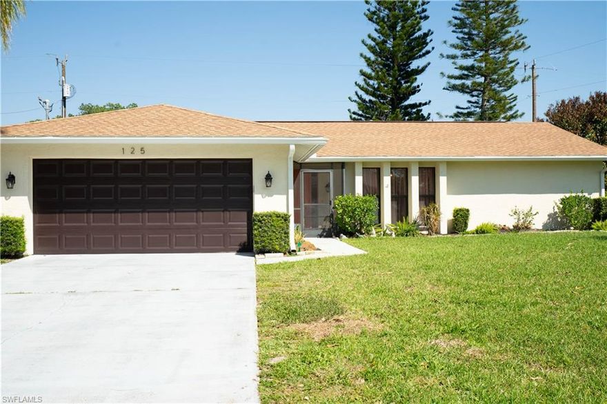 Welcome to 125 Sebring Circle-the perfect home for your first home or seasonal home. This 3 bedroom, 2 bathroom home is located in Country Club Estates where you'll appreciate homes that have been maintained well in an established neighborhood which has NO HOA fee.  NO FLOOD INSURANCE NEEDED.  You'll appreciate the spacious yard with irrigation on a corner lot that has canal views, the gorgeous kitchen with plenty of cabinets and space for multiple cooks, the spacious primary bedroom and ensuite bathroom with dual sinks and granite countertops, and the open floor plan with tile flooring throughout and additional living space of 340 +/- sq.ft. in the enclosed porch for added comfort.  Roof was replaced in 2023.  HVAC was replaced in 2025. Electric panel box was replaced in 2023.  New windows installed in 2025 (not impact resistant). Be sure to schedule a showing today of this amazing home!