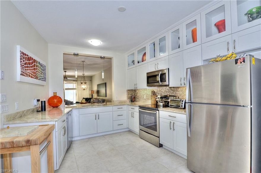 Get ready to be totally SOLD - this 100% renovated condo is spectacular, new from the roof to the floors, custom cabinets, Hurricane windows throughout, french doors leading out to the sunny lanai...so sweet and extremely private.  Even the garage has been updated and freshly painted ....You will not find a condo that can compete with this one. Total new construction top to bottom - one car garage - in one of East Naples most sought after communities WAY UNDER $300K  ....TOTAL WOW FACTOR !!!  OPEN SATURDAY November 23   from 2 - 4 for the first time. If you are looking for a Naples hot spot this is it -  FYI 4 miles to the beach, best shops and restaurants in town....yup Starbucks is right around the corner and so is your brand new PUBLIX - you could walk to them !!!
