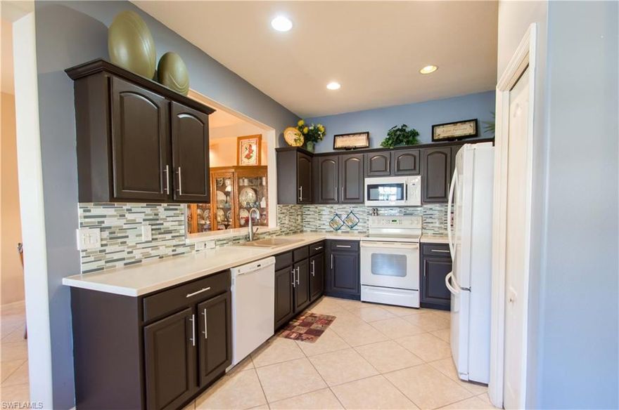 Unbelievable find, this comfortable, open concept 1­story condo has 3 bedrooms, 2 baths, and a 1 + golf­cart garage. This end unit is perfect for relaxing at home or entertaining friends and guests with its split bedroom floor­plan and open living area. New AC and Washer/Dryer combo in 2015. A true deal for full­time, part­time, and investors alike. Located in the gorgeous golf and country club of Herons Glen is a gated championship golf and country club community with so much to offer including: 45,000 sq. ft. Clubhouse, Ballroom, Restaurant/Lounge, Golf, 6 Har­Tru Tennis courts, Pickleball, heated & lakefront saltwater pool, Bocce, Shuffleboard, Billiards, a Fitness Area, Card & Craft Rooms, 2 Libraries. 18­hole championship Golf Course designed by Ron Garl & further redesigned by Gordon Lewis. Golf memberships are optional and boast of some of the lowest fees in the area.