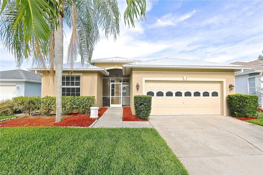 Enjoy this beautiful 3BR/2BA-2 car garage, pool home with 1,504 square feet of living space. Partial lake view, where you can enjoy peace and comfort. This home offers luxury upgrades and updates at a good value. The kitchen is a work-of-art with NEW 2017 custom wood cabinetry with glass inserts, granite countertops and stainless appliances. Interior features include living areas with all NEW 2017 installed 24” x 24” porcelain tile and 8” crown moldings on the high ceilings enhanced with recessed lighting. Dimmer control switches allow for ambiance. Walk into the bedrooms with bamboo wood floors. Look for lower long-term maintenance costs with NEW metal roof with gutters, AC and WH replaced 2015, newer screen on lanai/pool cage. In the bathrooms, granite countertops, custom wood cabinets and luxury toilets. The master bath has sliding shower head fixtures. Home is freshly painted. Outside, solar heated, screened pool with plenty of sun decks make this home wonderful for outdoor living or dining. Also included are storm shutters. Low HOA fees. Excellent location, minutes to the beaches, Fifth Ave. or I-75. This home is ready for you to move in. Act quickly. Call to see it today.