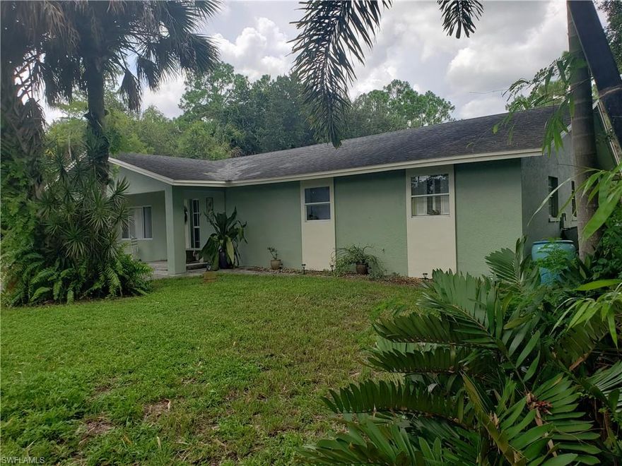 Unique opportunity to own TWO homes with many benefits at an AFFORDABLE PRICE. Incredible value and income producing, should you desire to rent out one house and use it to pay your mortgage! The property offers a great set-up for a rental with two separate driveways. The main home features 3 bedrooms, and 2 baths and the guest house has 2 beds and 1 bath. Much to offer with lots of space, open living areas, tile throughout, freshly painted. The lushly landscaped 2.34 acres is rich with native and mature plantings and fruit trees galore including 4 mango trees, Seville orange trees, 1 kumquat, 1 rough lemon, 1 pink lemon, 1 ponderosa lemon, and 1 guava. 50 amp charging service outside and huge fenced backyard with plenty of room for a pool and even more land beyond the fence. The property is conveniently located close to major shopping malls, restaurants, 5th Avenue and beautiful Naples beaches. Don’t miss this great opportunity! All offers encouraged!