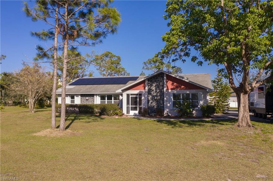 All the privacy and freedom of living in the country while only minutes away from the nearest Starbucks! This spacious 3 bedroom, 2 bath home sits on an ample 1.58 acres that embodies the lush natural beauty of Southwest Florida and includes a tranquil pond, chicken coop, a stunning, ancient oak tree surrounded by vibrant bird of paradise and bromeliads, prolific mango trees, and a grove of banana trees.  The recently updated saltwater pool sits within a fully screened lanai.  

Ample parking is available for any and all vehicles you may have including a two car garage (with additional insulation and air vents allowing you the option of extending your indoor space), a 12x25 carport (perfect for an RV, boat, or oversized vehicle), a 20’x25’ workshop or garage, and two garden sheds.

Did I mention the entire property is fenced including the driveway gate? This additional level of seclusion allows you peace of mind if children or pets live with you. Your dog could have free, unbridled reign of over an acre and a half of safe, traffic-free exploration! 

This is a must see! Don't forget to make your appointment today, you will love this piece of paradise!