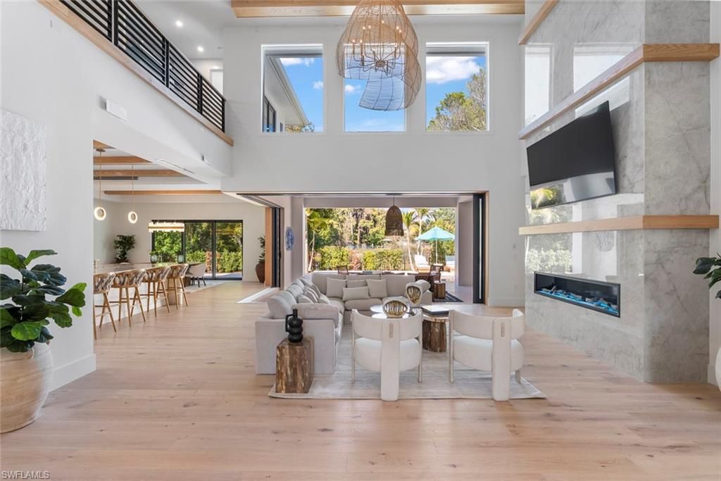 Photo of 565 Whispering Pine LN, NAPLES, FL 34103 (MLS # 225061336)