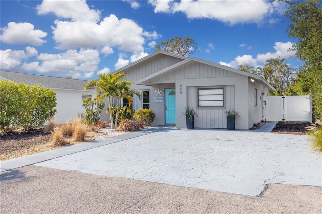 Photo of 668 94th AVE N, NAPLES, FL 34108 (MLS # 226021103)