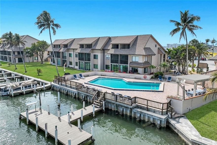 Waterfront living at its finest at Sportsmans Cove Yacht & Racquet Club!
Enjoy sparkling bay views and coastal breezes from this beautifully maintained cozy 1BR/1BA condo on San Carlos Island, just minutes from Fort Myers Beach. Perfect as a seasonal retreat, investment property, or maintenance free retirement living.
The bright white kitchen offers soft-close cabinets, stainless steel appliances, granite countertops and recessed lighting throughout unit. The spacious living area opens to a glass-enclosed rear lanai with direct access to the community pool, backyard, docks, and bay.  In unit washer and dryer.
Amenities include tennis/pickleball courts, heated bayside pool, guest parking, boat ramp, fishing pier with cleaning station, and on-site boat/jet ski storage yard.  Impact windows and doors plus a 48' flood barrier wall provides added peace of mind.