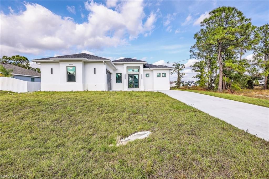 Photo of 2514 36th ST SW, LEHIGH ACRES, FL 33976 (MLS # 225082093)