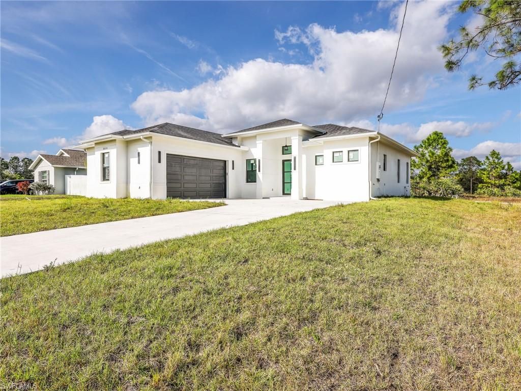 Photo of 2514 36th ST SW, LEHIGH ACRES, FL 33976 (MLS # 225082093)