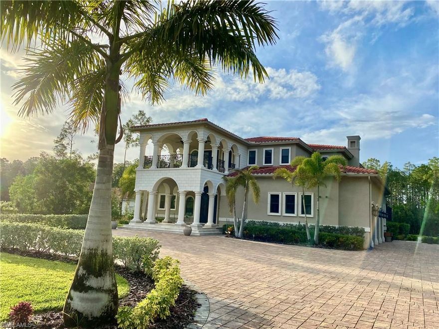 Welcome to this timeless elegant custom built two story transitional estate home situated on 2.5 acres in one of the best lots in Livingston Woods! This home was built to the highest standards with 5 suite sized bedrooms, 5.5 bathrooms, and 3.5 garage bays with extended storage, finished epoxy floors and 3 oversized high lift bays, extensive lanai, 2 laundry rooms, three a/c units, modern gas fireplace, large porcelain tile and wide-plank wood flooring, 12 to 25ft. grand ceilings, custom molding, wolf & subzero appliances, walk in pantry, 3 wet bars with beverage center, an upgraded security system, smart home with CAT 5 wiring and wired speakers, the master retreat includes two custom walk-in master closets, master bath Jacuzzi tub, oversized custom his and her shower with an exercise area. Masterfully designed for Florida living, the interior living spaces blend with the outdoor living areas through glass sliders, French doors, luxurious outdoor kitchen, resort style lap pool with sun shelf and jacuzzi spa that fits 12.  This home is hurricane proof with all impact windows and doors, spray foam insulation throughout and a whole-home generator (1,000 gallon propane tank).