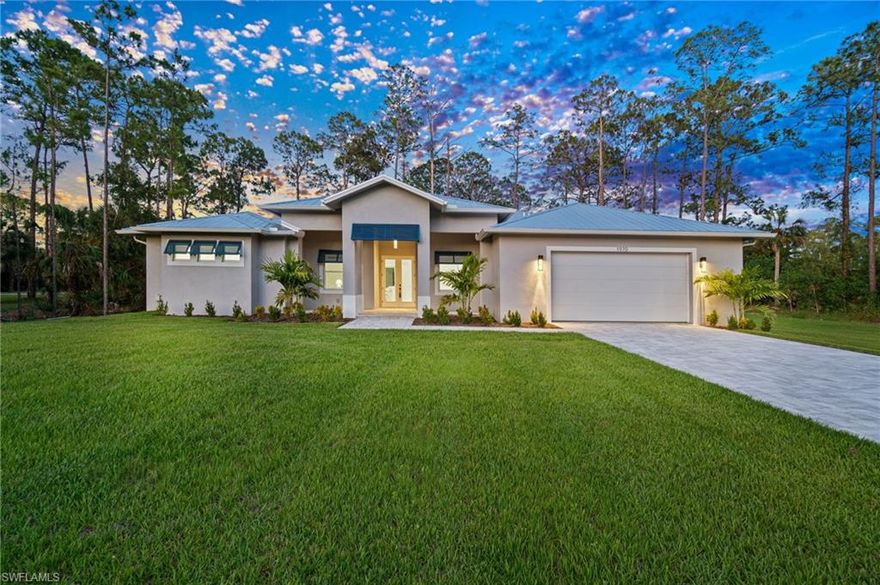 Beautifully crafted new construction custom home, with a full one-year builder warranty. On 100% uplands 2.6-acre lot located west of Wilson Boulevard, not in a flood zone and not in a HOA development.  Property suitable for guest house, pool/spa, outdoor kitchen, barn, horses, or additional structures. Home features custom wood cabinetry with abundant storage, quartz countertops, solid interior doors, tray ceilings, crown molding, recessed LED lighting, with extra-large ceramic tile flooring throughout. Custom decorative wall panels throughout adding sophistication and a nice personal touch. Master bedroom with his and hers oversized walk-in closets, large soaking tub, dual vanities and private toilet area. Other important features include hurricane-impact windows and doors, extended driveway, oversized two-car garage with epoxy flooring, and flexible space adjacent to the kitchen ideal for a walk-in pantry, coffee bar, or home office. Schedule your private showing and make this home yours.