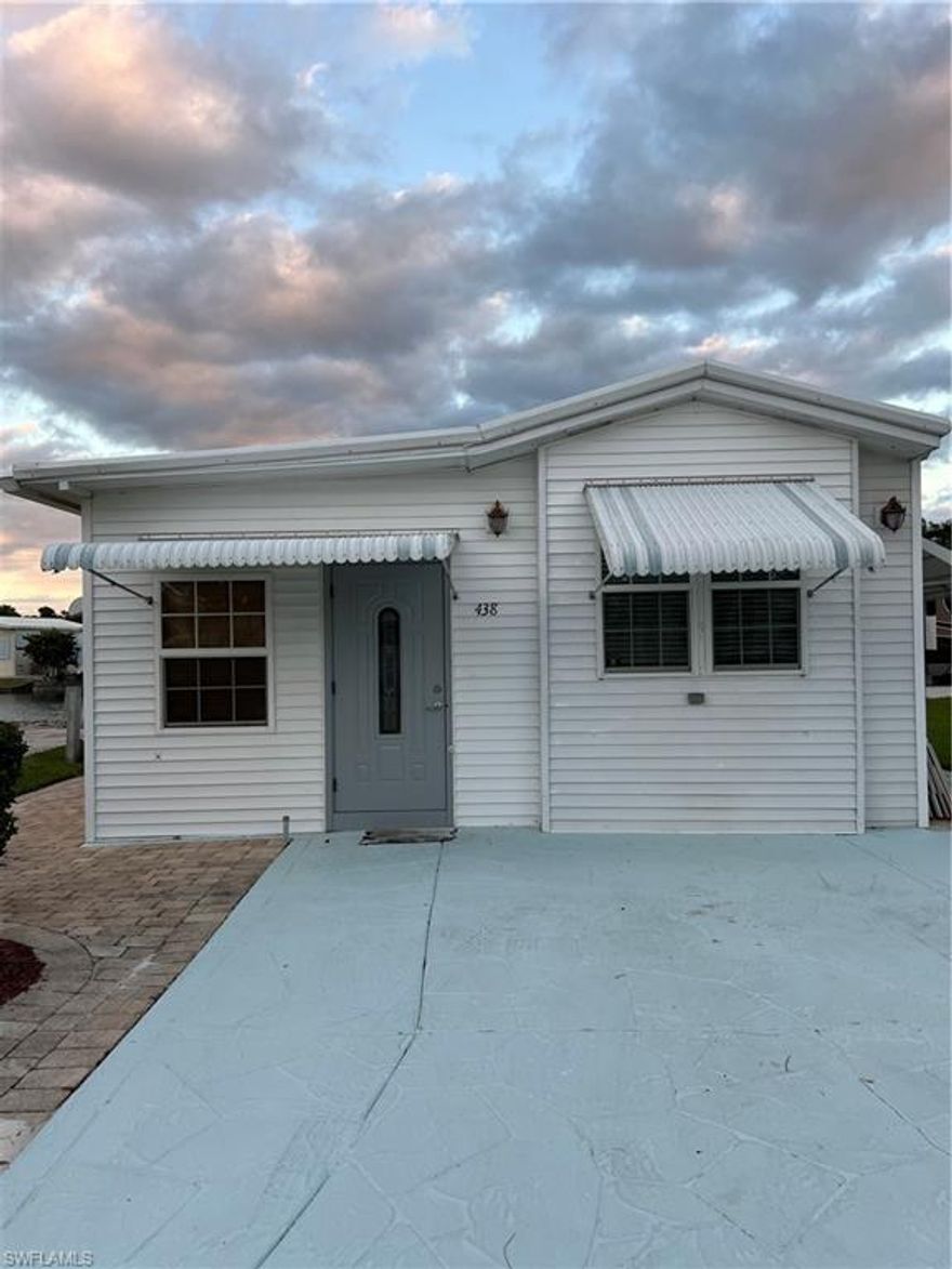 NO HURRICANE DAMAGE TO HOME  FROM IAN!  Welcome to Imperial Wilderness, an active, 55+, gated community where you OWN the land.  This home is just amazing!  It has been completely renovated with virtually nothing left undone.  It features a beautiful glass backsplash in the renovated kitchen, "Smartcore" floors, 200 AMP service, and more. With the 200 AMP service comes a hook up for a whole house generator system. This home is located toward the back of the park so it is much quieter.  It has newer windows.  It is close to the dog park. It also has a nice sized open area to the south of the property.  The patio furniture and the 12' Sunsetter awning stay with the house.  The patio features well taken care of pavers as does both sides of the house.  It has a 10' retainer wall off the patio.