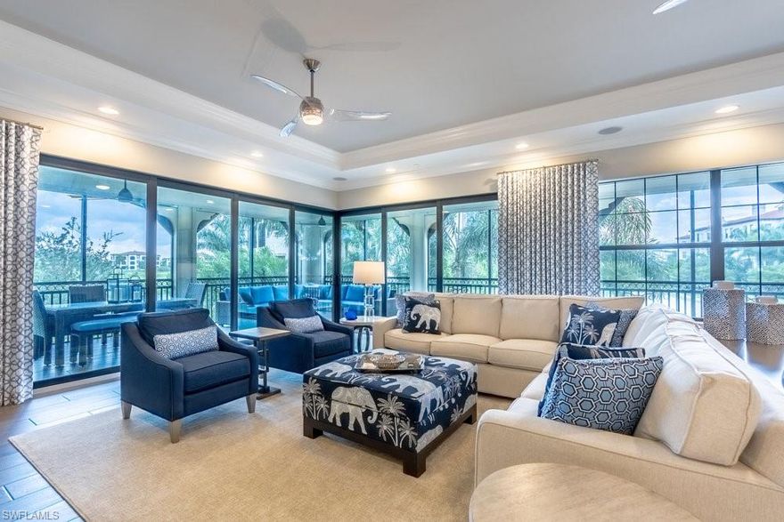 This first floor "Penthouse Carrara Model" comes furnished and was professional decorated by Jinx McDonald interior designs! Extensive upgrades throughout; automatic storm screens, Quartzite kitchen countertops and backsplash, porcelain tile floors, enclosed glass showers, Sonos surround sound and security system.  Amazing waterfall/rock feature and golf course views from hole 1 outside your wrap around loggia area and master bedroom. 2 assigned parking spots on ground floor with additional private storage space. “Carrara” @ Talis Park includes 90 individually owned finished & built out spacious units of maintenance free condo living. Carrara has its own private pool, spa and grills just for the street. Talis Park's golf course was designed by Greg Norman and Pete Dye and is ranked by Golf Digest as one of Florida's top 20 courses. Short bike ride or golf cart drive to the new clubhouse (voted Clubhouse of the year 2016 by Golf Inc. Magazine!) “Vyne House” offers a Pilates/Yoga Studio, Core Fitness Center & Esprit Spa plus Fiona’s Market Café! Talis Park is now offering a private beach shuttle to Vanderbilt Beach!