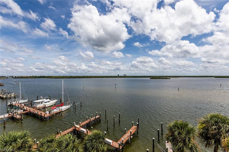 Come and enjoy breathtaking wide-water views of the Marco River from this delightful top-floor tropical getaway. Watch the dolphins, birds and boats of all shapes and sizes pass by this magical location. One of the desirable, larger Riverside residences that also comes with a covered parking space. This sparkling jewel on the river offers great amenities, including two large pools with spas, boat slips for lease with a marina and clubhouse, tennis courts and a fishing pier. Conveniently located just a short distance to restaurants, shops and the quaint, historic Old Marco Village. This is Florida waterfront living at its best.