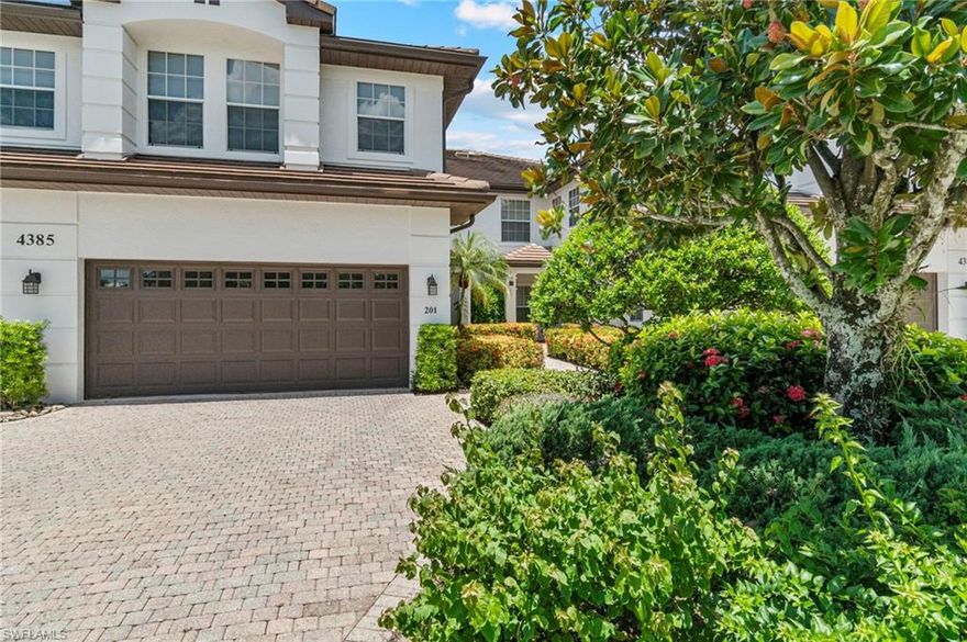 Welcome to Kensington—a gated, centrally located Naples community offering convenient access to world-class beaches, fine dining, shopping, and entertainment. This beautifully maintained coach home is nestled on a quiet cul-de-sac with peaceful views of the #15 hole on Kensington’s prestigious golf course—just steps from the community pool and clubhouse.

From the moment you enter, you're greeted by abundant natural light that flows throughout the open-concept layout, creating a warm and inviting atmosphere. The spacious great room features pocketing sliders that seamlessly connect to the screened lanai, framing serene golf course views and allowing light to pour in. The bright kitchen is perfect for entertaining, offering generous counter space, a walk-in pantry, and an airy layout designed to enjoy the sunshine from every angle.

The light-filled primary suite includes a cozy sitting area, two closets (including a walk-in), and a luxurious bath with dual vanities, a soaking tub, and a separate shower. A second bedroom and bath can be enclosed with pocket doors to create a private guest retreat, while the third bedroom—with closet—offers flexible use as a den or office. Additional features include a large air-conditioned storage room and an attached two-car garage.

Kensington Golf & Country Club offers a vibrant, resort-style lifestyle with optional membership levels—social, sport, or golf. Enjoy tennis, pickleball, bocce, a resort-style pool, full-service dining, and a full calendar of social events. Pet-friendly and close to everything Naples has to offer—this sunlit sanctuary is Florida living at its finest!