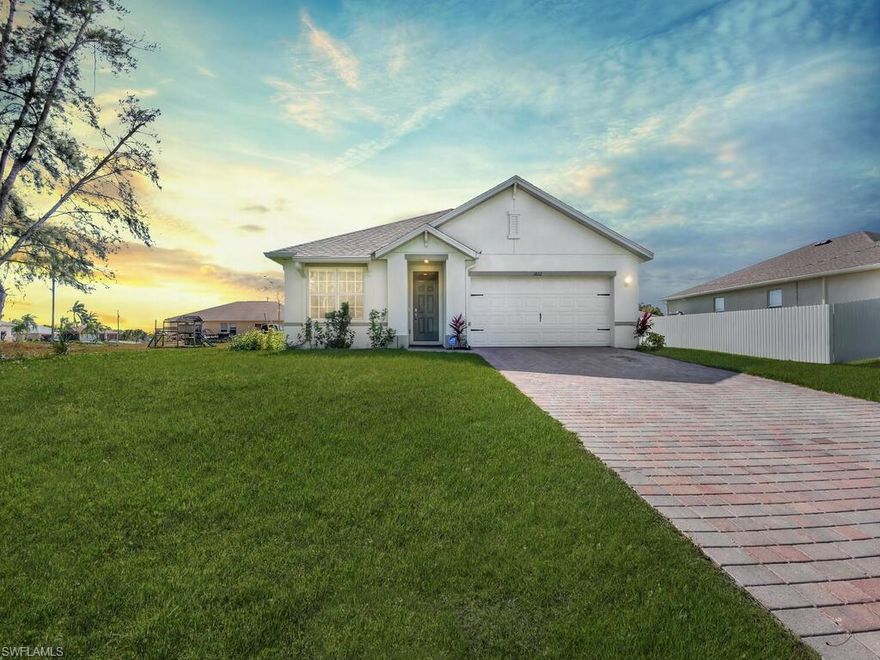 Wonderful Cape Coral location! This home - JUST BUILT IN 2021 - is situated in a non-gated neighborhood w/ NO HOMEOWNER FEES. Offering a great room layout w/ volume ceilings, split bedroom floor plan, quartz countertops throughout, tile flooring in main living areas, security system w/ alarms on windows including glass break alert, open rear lanai, spacious backyard w/ enough room for a pool, and a 2-car garage. Surrounded by other custom built single family homes and close to all the conveniences of life- easy access to US 41, only 9 minutes to the redeveloped River District, 5 miles from the family fun of Sun Splash Waterpark, and less than 30 minutes from the art boutiques & awesome seafood of Matlacha.