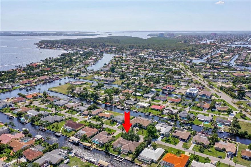 H1686  - This WATERFRONT POOL HOME is on a TRIPLE LOT located on a QUIET cul-de-sac in the desirable Yacht Club area.  It only takes 3-4 MINUTES to get out to the RIVER...NO BRIDGES!  This house is HUGE with an EXTRA LARGE TWO CAR GARAGE & SO MUCH STORAGE! THE VIEWS ARE AMAZING THROUGHOUT the home & on the EXTRA LARGE LANAI!  It has 4 bedrooms, 3 full baths, eat-in kitchen, formal dining room, living room, family room, large Laundry room with MORE STORAGE & a sewing/hobby room.  It has it ALL! You don't want to miss this as it will not be on the market long!