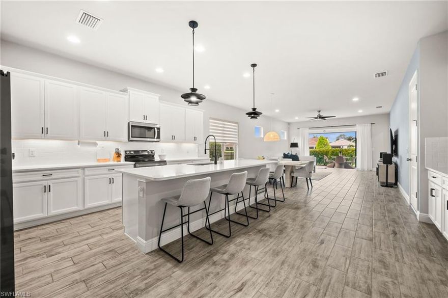 Located in the highly desirable gated community of Compass Landing in North Naples, this beautifully maintained and fully furnished 3-bedroom + den home offers the perfect blend of comfort, style, and functionality. The light-filled open floor plan features abundant natural light and modern finishes throughout, including a spacious kitchen with quartz countertops, stainless steel appliances, and a large island ideal for both everyday living and entertaining.

The home feels inviting, clean, and thoughtfully designed, with beautiful furnishings and décor that create a warm and welcoming atmosphere. The primary suite provides a private retreat with a walk-in closet and en-suite bath, while the additional bedrooms and versatile flex room and den offer flexibility for guests, a home office, or additional living space.

Step outside to enjoy a peaceful lake view setting and a private outdoor space perfect for relaxing or hosting, along with a fenced-in lawn. Residents of Compass Landing enjoy access to resort-style amenities including a clubhouse, pool, fitness center, and playground.

Ideally located just minutes from shopping, dining, and everything North Naples has to offer, including nearby conveniences such as Logan Landing.