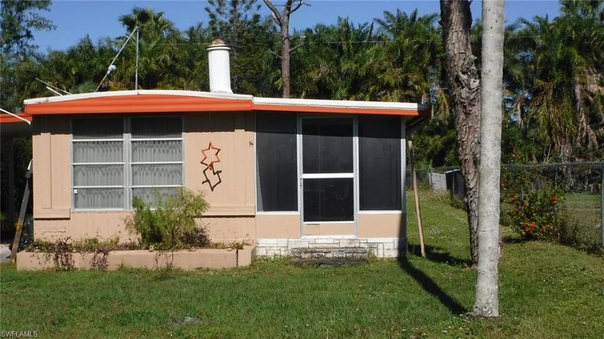 Great Investment potential off of Bayshore Rd. in North Fort Myers. This affordable home with a detached garage offers great income potential. This quiet country road is near growth and improvements on State Road 31 (new restaurants, shops and Babcock Ranch) which are paving the way for development in the area and the need for housing. This manufactured home offers a nice screened porch, fireplace, and will be sold partially furnished.
The owner built a small berm around the perimeter of the property so rain water does not accumulate.
The detached workshop/garage has electric and an overhead door.