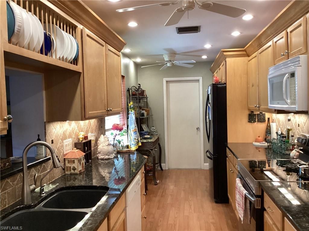 Photo of 3022 Poinciana DR, NAPLES, FL 34105 (MLS # 226010426)