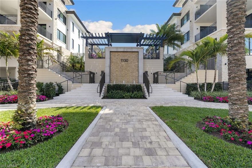 UNIQUE & EXCLUSIVE CORNER RESIDENCE IN QUATTRO AT NAPLES SQUARE. The only unit in the building with direct walk-out access to the pool deck and direct access to steps down to 3rd St S. This fully customized, professionally designed home features an enhanced floor plan and luxury upgrades throughout, far exceeding developer standards. Beautifully finished with upgraded marble, stone, and fixtures. Premium additions including an infrared sauna, soda water on tap in the bar, and modern Italian designer lighting. This 3 bedroom + den residence lives like new construction and showcases hardwood flooring throughout, 10’ ceilings, impact-resistant windows, custom built-ins with illuminated purse and shoe displays, a walk-in pantry, motorized shades, water filtration/conditioning, and more.The chef’s kitchen is appointed with a commercial Sub-Zero refrigerator, upgraded Wolf appliance package with natural gas cooking, a wine fridge, and a wet bar with ice maker . Additional features include two side by side garage parking spaces with EV Charging, a private storage unit, and access to the exceptional amenities of Quattro and Naples Square.A resort-style pool with firepit and grilling area, fully appointed social room with kitchen and billiards table, and a state-of-the-art fitness center.Perfectly positioned in the heart of downtown Naples, just a short walk to 5th Ave S shopping & dining, 3rd Street South amenities, and world-class beaches and parks.