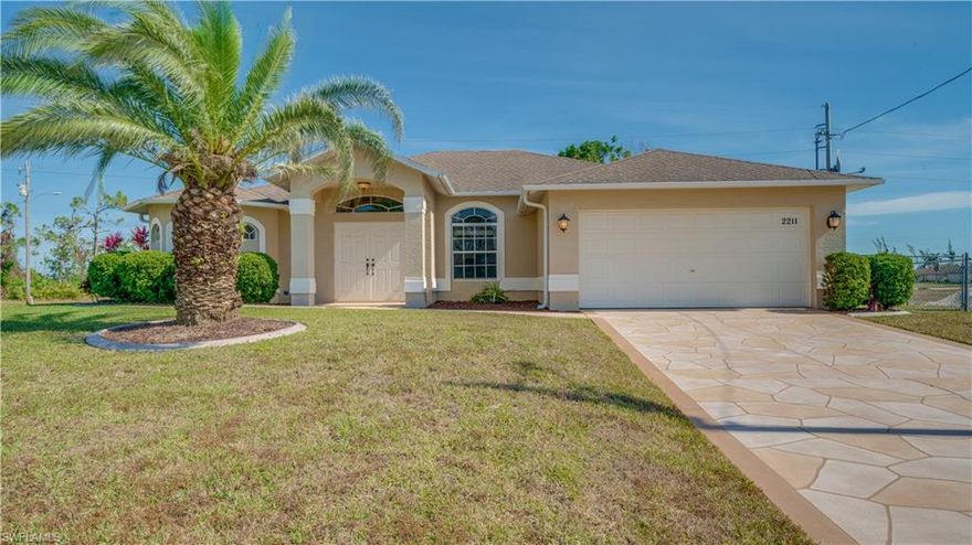 Beautiful architectural details in this amazing 4 bedroom 2 bath home with a FENCED BACK YARD on a CORNER LOT! With Newly Remodeled tile floors, the home has special details like french doors, tray and vaulted ceilings, transom windows, huge master bath showers, and soaking tubs, then you should see this home. The master bedroom has sliders leading to the oversized lanai. Large walk-in closets abound. The floor plan is split giving the master suite complete privacy from the other 3 bedrooms. The second bathroom has an exit door to the lanai. The kitchen is open with 42” cabinets, newer appliances, pantry, plus a breakfast bar and nook. There is a whole house water softening system and an RO system in the kitchen. Because this home is on a well and has a septic system there are no assessments outstanding. Coral Oaks Golf Course is very close by! This is a very extravagant home, book your appointment today! Virtual Tour Available upon request! Motivated Seller, no Damages from the Hurricane!