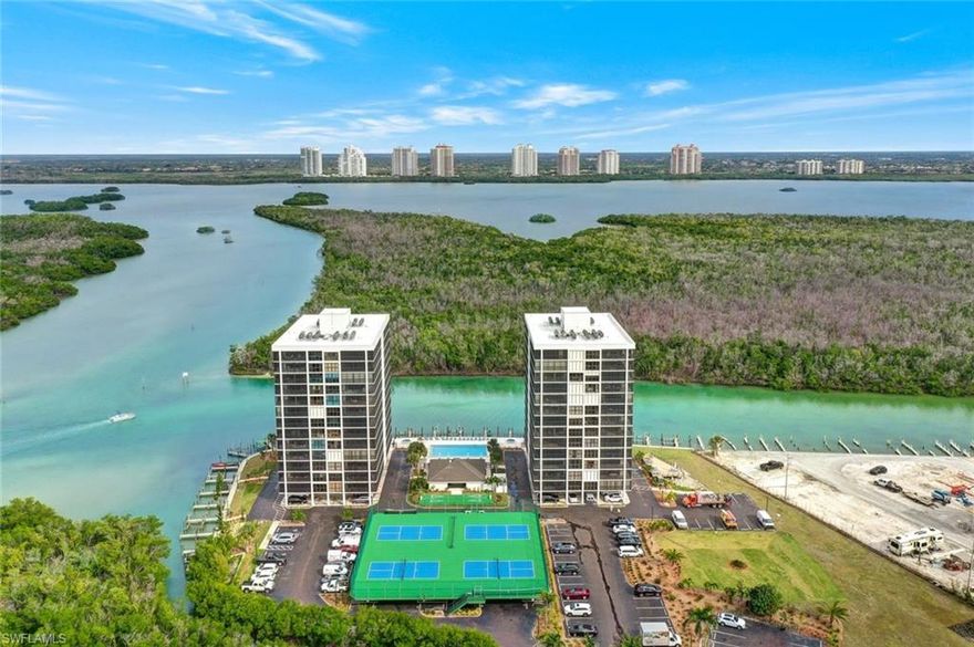 Available 2026 season. Introducing Bay Harbor I Unit 10C, a stunning 2-bedroom, 2-bathroom condo located at 26225 Hickory Blvd #10C, Bonita Springs, FL. This rental gem boasts a spacious split floor plan, perfect for short-term stays. Now Booking 2026 season. Immerse yourself in the beauty of Gulf of Mexico sunsets and refreshing sea breezes while lounging on the panoramic wrap-around balcony, which features hurricane shutters enclosing the entire lanai for added peace of mind. This turnkey furnished unit includes all essentials for a comfortable stay, including a full-size washer and dryer. Step outside to indulge in community amenities such as a swimming pool, two hot tubs, tennis/pickleball courts, and shuffleboard. Private beach access is conveniently located just across the street. Entertainment options abound nearby, from golfing and state parks to restaurants and the arts. Sports enthusiasts will appreciate the proximity to spring training baseball facilities. Included in the rental package is one covered carport parking space, along with cable TV, central air conditioning, ceiling fans, internet access, and WiFi. Don't miss the opportunity to secure this exceptional rental today!