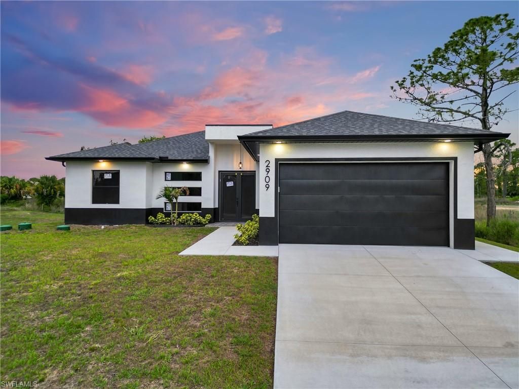 Photo of 2909 Dora AVE N, LEHIGH ACRES, FL 33971 (MLS # 226020770)