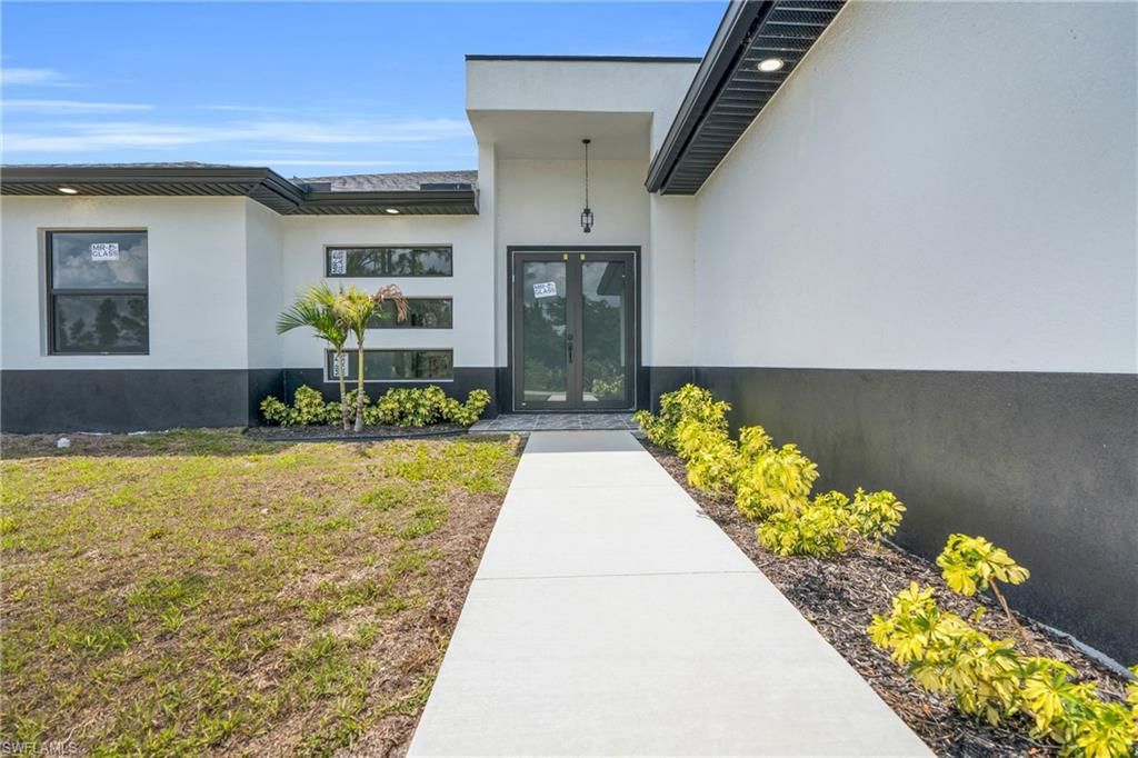 Photo of 2909 Dora AVE N, LEHIGH ACRES, FL 33971 (MLS # 226020770)