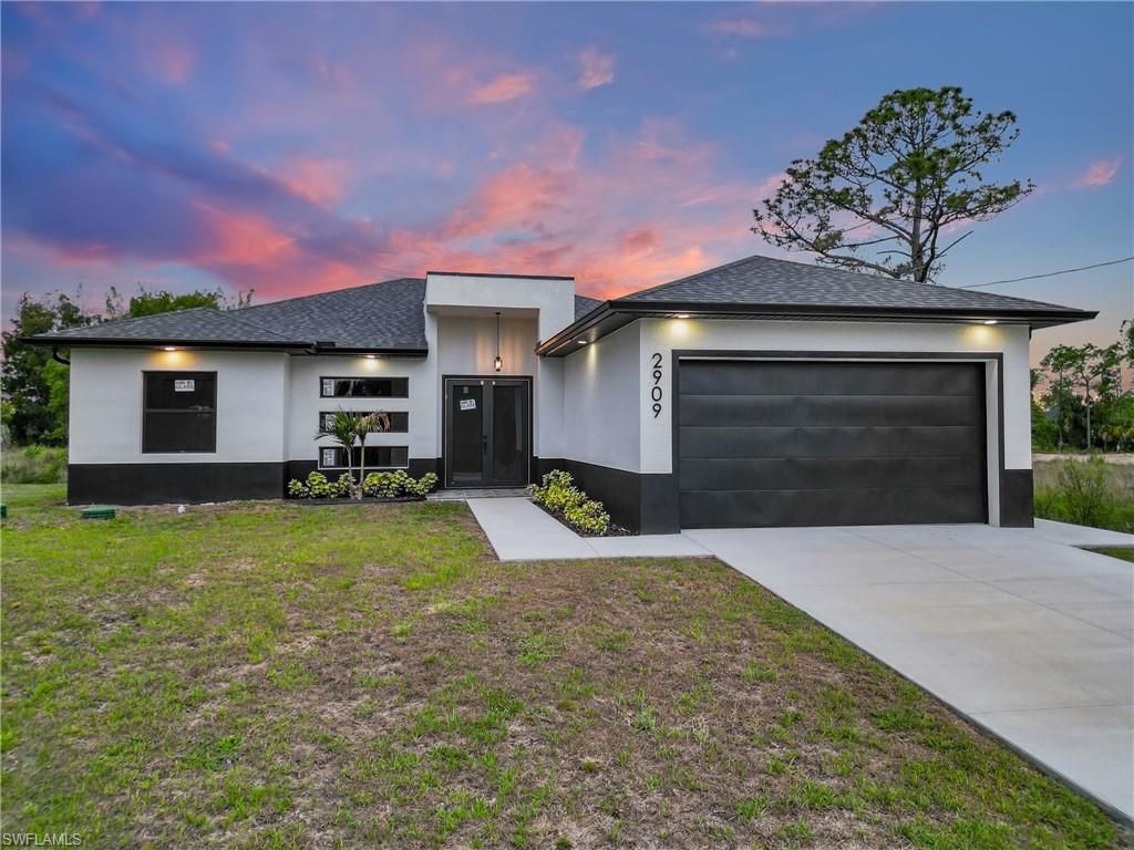 Photo of 2909 Dora AVE N, LEHIGH ACRES, FL 33971 (MLS # 226020770)